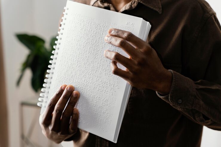 blind man reading braille with hands-Apex Braille (Services)