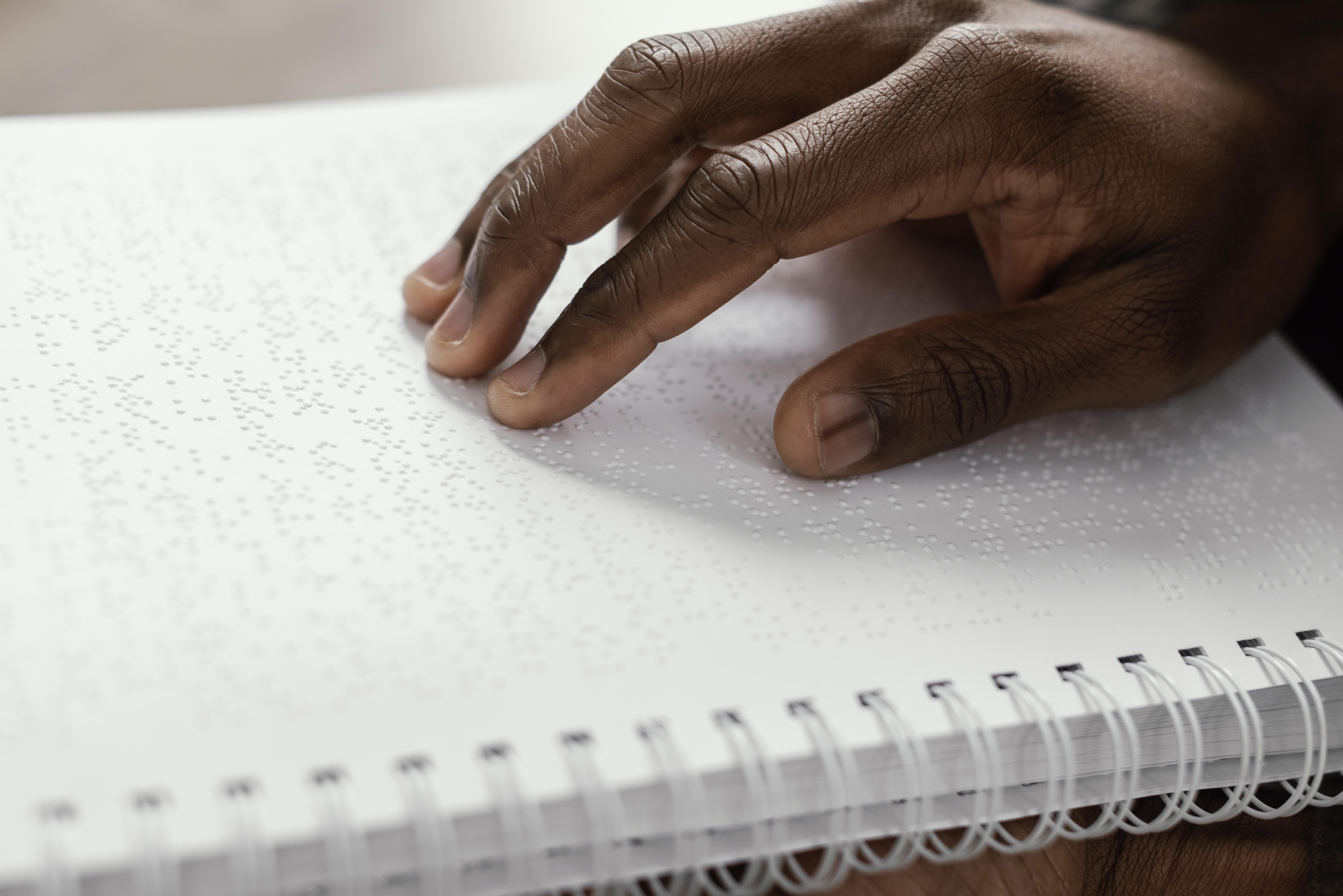 close up hand braille notebook-Apex Braille (Tactile Graphics)