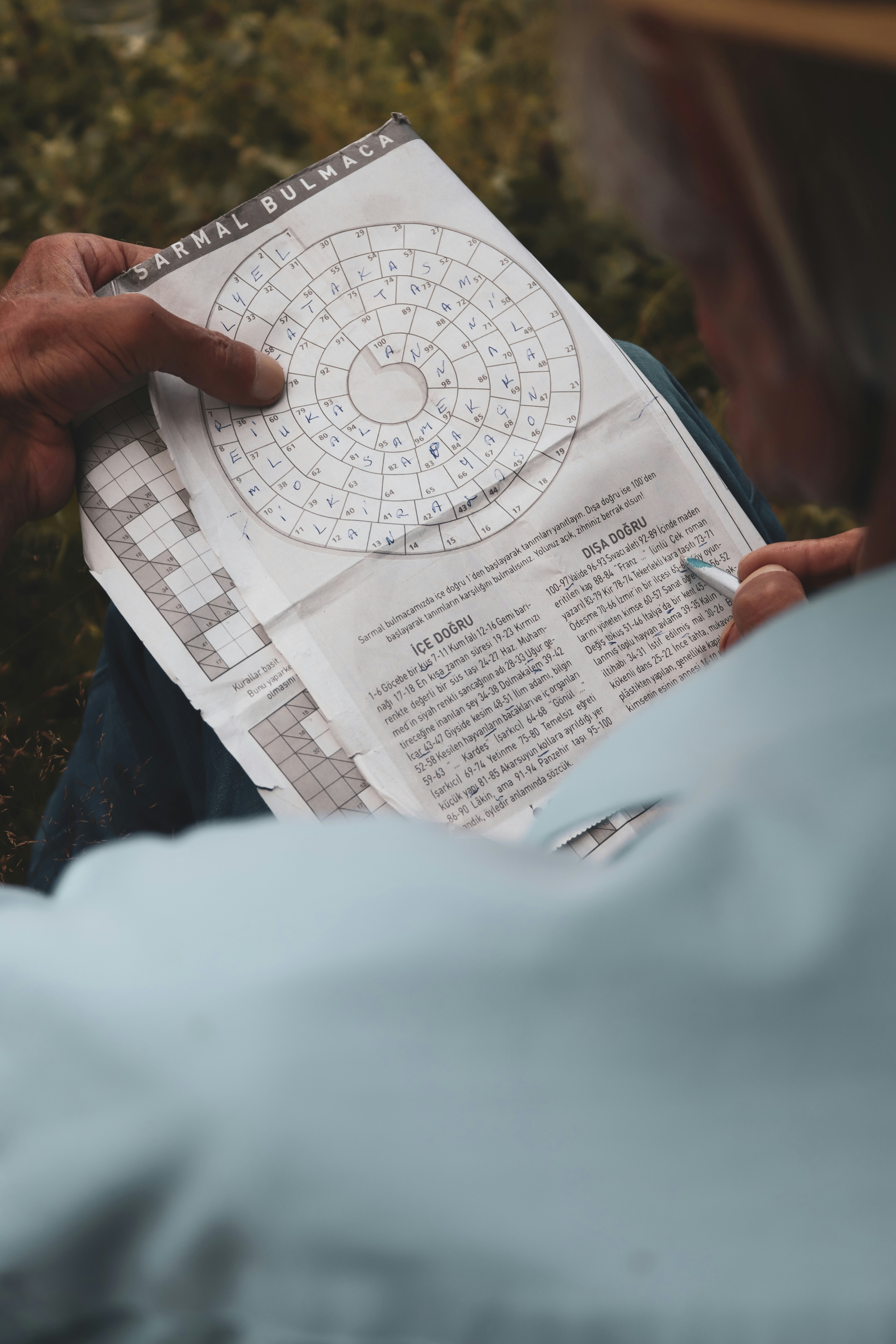 Person doing a spiral puzzle-Apex Braille (Tactile Graphics)